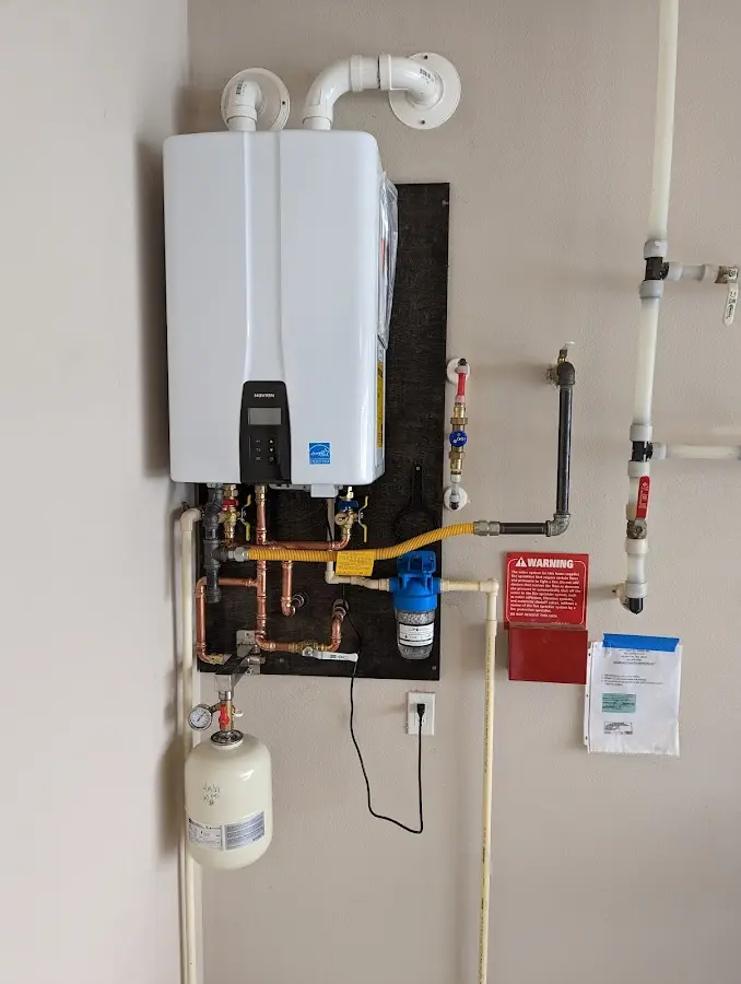 Professional plumber installing copper piping in a Indian River Estates home